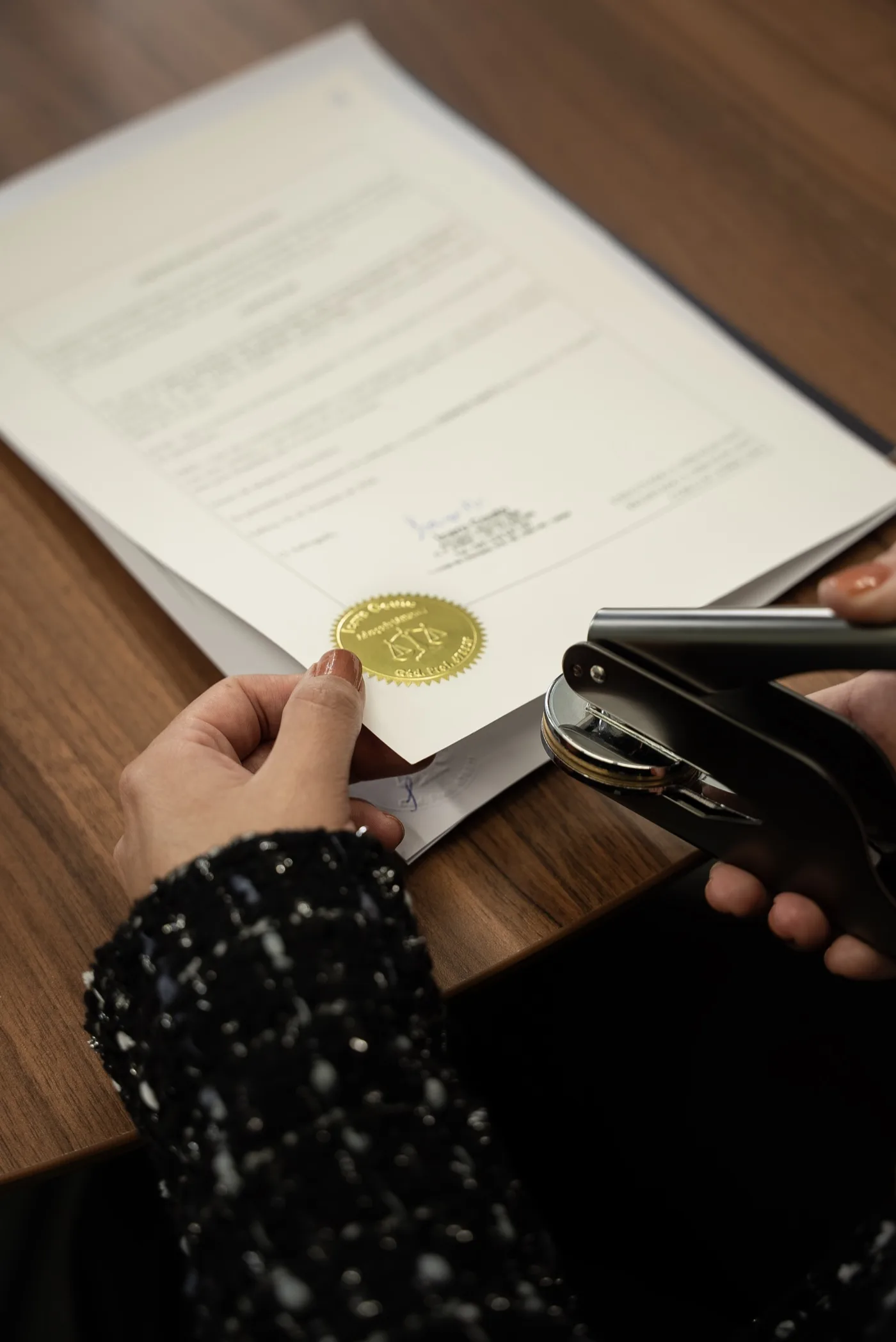 Registered solicitor at Blue Ocean Immigration stamping a sealed document